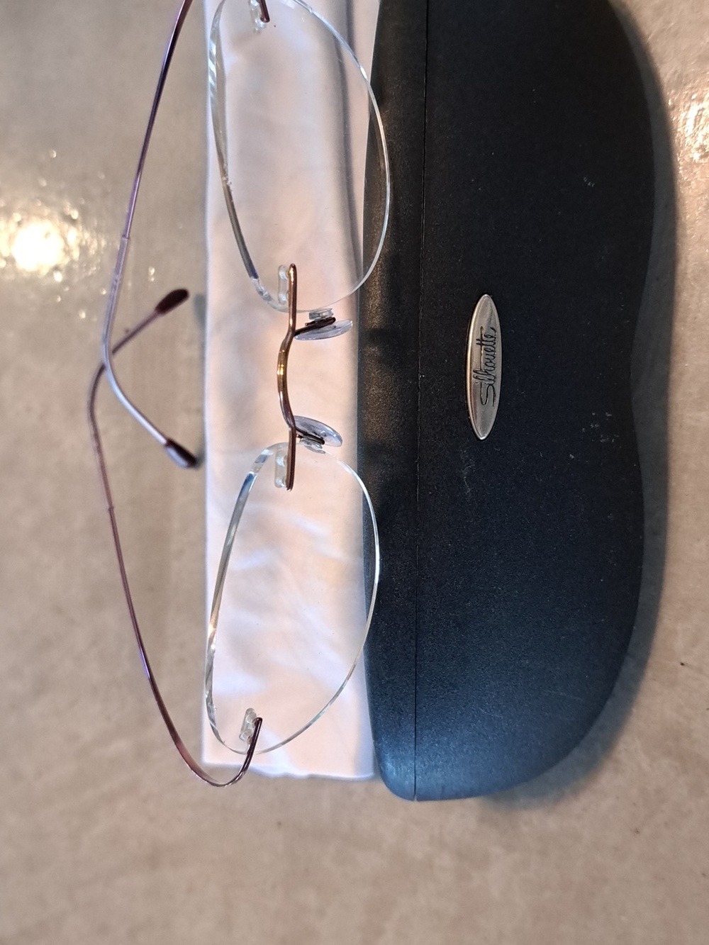 Silhouette 7395 17-49 Titanium rimless eyeglasses. Rose/gold. New Condition.